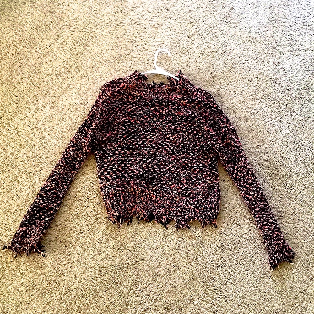 This is a cropped sweater. Does fit kind of small, only worn once.